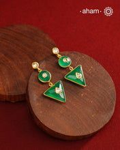 These Green Onyx Gold Polish Silver Earrings feature exquisite kundan inlay work, blending traditional craftsmanship with contemporary style. Perfectly suited for Indo-Western ensembles, they add a touch of elegance and sophistication to your look. Crafted with attention to detail, these earrings enhance your outfit with their green onyx contrast and subtle gold polish, making them a versatile accessory for special occasions.