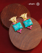 Gold Polish Silver Earrings. The earrings are handcrafted in 92.5 sterling silver with turquoise center and dipped in gold polish.&nbsp;Style this up with your favourite ethnic or fusion outfits to complete the look.