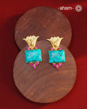 Gold Polish Silver Earrings. The earrings are handcrafted in 92.5 sterling silver with turquoise center and dipped in gold polish.&nbsp;Style this up with your favourite ethnic or fusion outfits to complete the look.