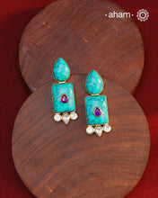 Gold Polish Silver Earrings. The earrings are handcrafted in 92.5 sterling silver with turquoise setting and gold polish. Style this up with your favourite ethnic outfits to complete the look.