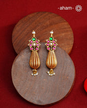 Add a touch of effortless glamour with our Gold Drop Silver Earrings. Crafted with silver and platted with gold polish, these earrings feature little kundan tops and a pearl drops,&nbsp; Perfect for any festive occasion