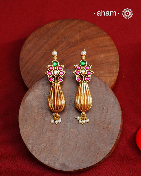 Add a touch of effortless glamour with our Gold Drop Silver Earrings. Crafted with silver and platted with gold polish, these earrings feature little kundan tops and a pearl drops,&nbsp; Perfect for any festive occasion
