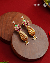 Add a touch of effortless glamour with our Gold Drop Silver Earrings. Crafted with silver and platted with gold polish, these earrings feature little kundan tops and a pearl drops,&nbsp; Perfect for any festive occasion
