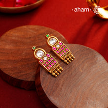 Introducing our Festive Gold Polish Silver Earrings - a traditional South Indian design crafted in 92.5 silver with kemp stone and kundan highlights. The stunning earrings feature a subtle dull gold polish, Perfect for adding a touch of traditional charm to any outfit.