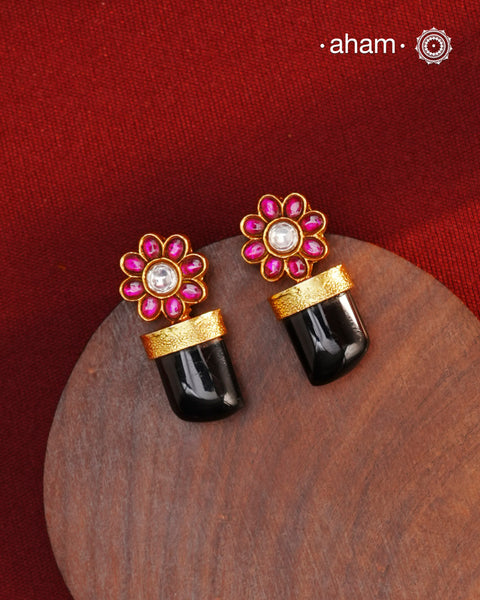 Indulge in luxurious elegance with our Black Drop Gold Polish Silver Earrings. These stylish pieces are crafted in 92.5 silver and dipped in gold, featuring eye-catching black onyx highlight. Elevate your look with these timeless beauties.