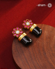 Indulge in luxurious elegance with our Black Drop Gold Polish Silver Earrings. These stylish pieces are crafted in 92.5 silver and dipped in gold, featuring eye-catching black onyx highlight. Elevate your look with these timeless beauties.