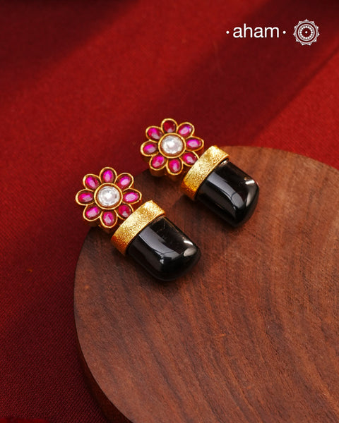 Indulge in luxurious elegance with our Black Drop Gold Polish Silver Earrings. These stylish pieces are crafted in 92.5 silver and dipped in gold, featuring eye-catching black onyx highlight. Elevate your look with these timeless beauties.