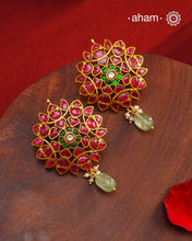 Expertly crafted with intricate kundan work, these Kundan Gold Polish Silver Earrings exude elegance and radiate sophistication. Made of 92.5 silver with a lustrous gold polish, they feature a timeless red and green color combination that pairs great with with most traditional Indian clothes. Elevate any outfit and make a statement with these exquisite earrings.