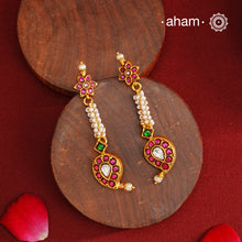 These Gold Polish Paisley Silver Earrings beautifully reflect the elegance of South Indian traditional design, featuring delicate kemp and pearl work. Crafted from 92.5% pure silver with a fine gold polish, it is a graceful and timeless design that complements your style effortlessly.