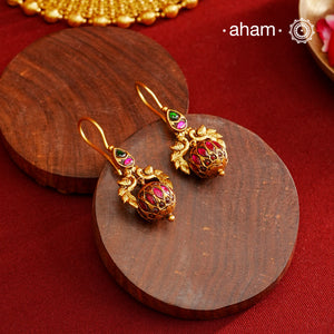 These Gold Polish Peacock Silver Earrings beautifully reflect the elegance of South Indian traditional design, featuring delicate kemp work. Crafted from 92.5% pure silver with a fine gold polish, it is a graceful and timeless design that complements your style effortlessly.