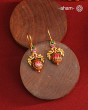 These Gold Polish Peacock Silver Earrings beautifully reflect the elegance of South Indian traditional design, featuring delicate kemp work. Crafted from 92.5% pure silver with a fine gold polish, it is a graceful and timeless design that complements your style effortlessly.