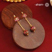 These Gold Polish Silver Earrings beautifully reflect the elegance of South Indian traditional design, featuring delicate kemp work. Crafted from 92.5% pure silver with a fine gold polish, it is a graceful and timeless design that complements your style effortlessly.