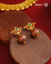 These Gold Polish Peacock Silver Earrings beautifully reflect the elegance of South Indian traditional design, featuring delicate kemp work. Crafted from 92.5% pure silver with a fine gold polish, it is a graceful and timeless design that complements your style effortlessly.