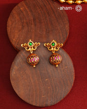 These Gold Polish Peacock Silver Earrings beautifully reflect the elegance of South Indian traditional design, featuring delicate kemp work. Crafted from 92.5% pure silver with a fine gold polish, it is a graceful and timeless design that complements your style effortlessly.