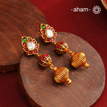 These Gold Polish Peacock Silver Earrings beautifully reflect the elegance of South Indian traditional design, featuring delicate kemp work. Crafted from 92.5% pure silver with a fine gold polish, it is a graceful and timeless design that complements your style effortlessly.
