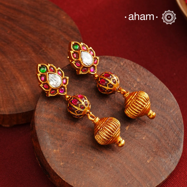 These Gold Polish Peacock Silver Earrings beautifully reflect the elegance of South Indian traditional design, featuring delicate kemp work. Crafted from 92.5% pure silver with a fine gold polish, it is a graceful and timeless design that complements your style effortlessly.
