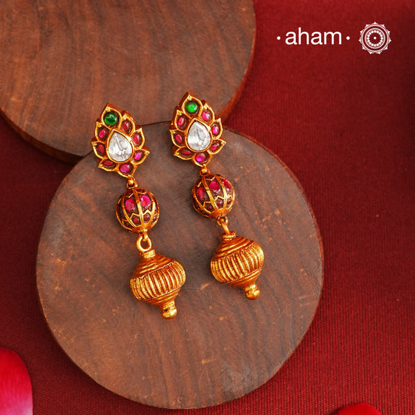 These Gold Polish Peacock Silver Earrings beautifully reflect the elegance of South Indian traditional design, featuring delicate kemp work. Crafted from 92.5% pure silver with a fine gold polish, it is a graceful and timeless design that complements your style effortlessly.