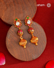 These Gold Polish Peacock Silver Earrings beautifully reflect the elegance of South Indian traditional design, featuring delicate kemp work. Crafted from 92.5% pure silver with a fine gold polish, it is a graceful and timeless design that complements your style effortlessly.