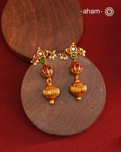 These Gold Polish Peacock Silver Earrings beautifully reflect the elegance of South Indian traditional design, featuring delicate kemp work. Crafted from 92.5% pure silver with a fine gold polish, it is a graceful and timeless design that complements your style effortlessly.