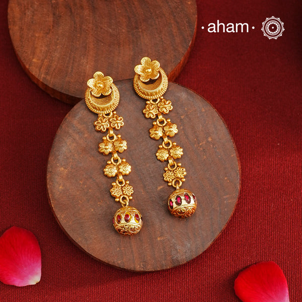 Beautiful half moon kemp drop earrings&nbsp; Handcrafted using traditional methods in 92.5 sterling silver with gold polish. Pair these with your ethnic outfits this festive season to ace your look.