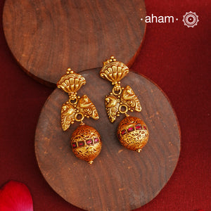 These Gold Polish Peacock Silver Earrings beautifully reflect the elegance of South Indian traditional design, featuring delicate kemp work. Crafted from 92.5% pure silver with a fine gold polish, it is a graceful and timeless design that complements your style effortlessly.