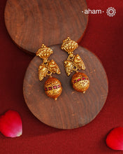 These Gold Polish Peacock Silver Earrings beautifully reflect the elegance of South Indian traditional design, featuring delicate kemp work. Crafted from 92.5% pure silver with a fine gold polish, it is a graceful and timeless design that complements your style effortlessly.