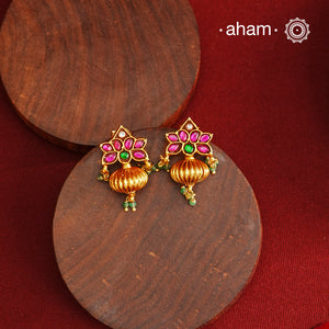 These Gold Polish Peacock Silver Earrings beautifully reflect the elegance of South Indian traditional design, featuring delicate kemp work. Crafted from 92.5% pure silver with a fine gold polish, it is a graceful and timeless design that complements your style effortlessly.
