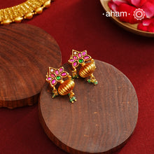 These Gold Polish Peacock Silver Earrings beautifully reflect the elegance of South Indian traditional design, featuring delicate kemp work. Crafted from 92.5% pure silver with a fine gold polish, it is a graceful and timeless design that complements your style effortlessly.