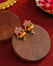 These Gold Polish Peacock Silver Earrings beautifully reflect the elegance of South Indian traditional design, featuring delicate kemp work. Crafted from 92.5% pure silver with a fine gold polish, it is a graceful and timeless design that complements your style effortlessly.