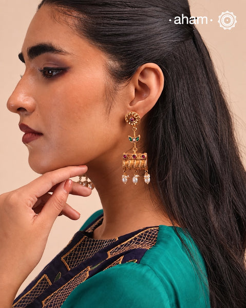 These Gold Polish Silver Earrings beautifully reflect the elegance of South Indian traditional design, featuring delicate kemp work. Crafted from 92.5% pure silver with a fine gold polish, it is a graceful and timeless design that complements your style effortlessly.