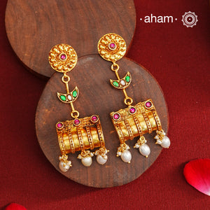 These Gold Polish Peacock Silver Earrings beautifully reflect the elegance of South Indian traditional design, featuring delicate kemp work. Crafted from 92.5% pure silver with a fine gold polish, it is a graceful and timeless design that complements your style effortlessly.