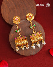 These Gold Polish Peacock Silver Earrings beautifully reflect the elegance of South Indian traditional design, featuring delicate kemp work. Crafted from 92.5% pure silver with a fine gold polish, it is a graceful and timeless design that complements your style effortlessly.