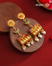 These Gold Polish Peacock Silver Earrings beautifully reflect the elegance of South Indian traditional design, featuring delicate kemp work. Crafted from 92.5% pure silver with a fine gold polish, it is a graceful and timeless design that complements your style effortlessly.