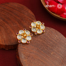 Little Kundan flower studs Handcrafted using traditional methods in 92.5 sterling silver with gold polish. Pair these with your outfits this festive season to ace your look.