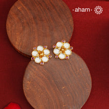 Little Kundan flower studs Handcrafted using traditional methods in 92.5 sterling silver with gold polish. Pair these with your outfits this festive season to ace your look.