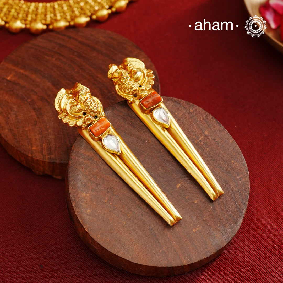 Stylish peacock earrings with coral and kundan ascents. Handcrafted using traditional methods in 92.5 sterling silver with gold polish. Pair these with your ethnic outfits this festive season to ace your look.