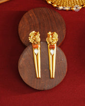 Stylish peacock earrings with coral and kundan ascents. Handcrafted using traditional methods in 92.5 sterling silver with gold polish. Pair these with your ethnic outfits this festive season to ace your look.