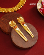 Stylish peacock earrings with coral and kundan ascents. Handcrafted using traditional methods in 92.5 sterling silver with gold polish. Pair these with your ethnic outfits this festive season to ace your look.