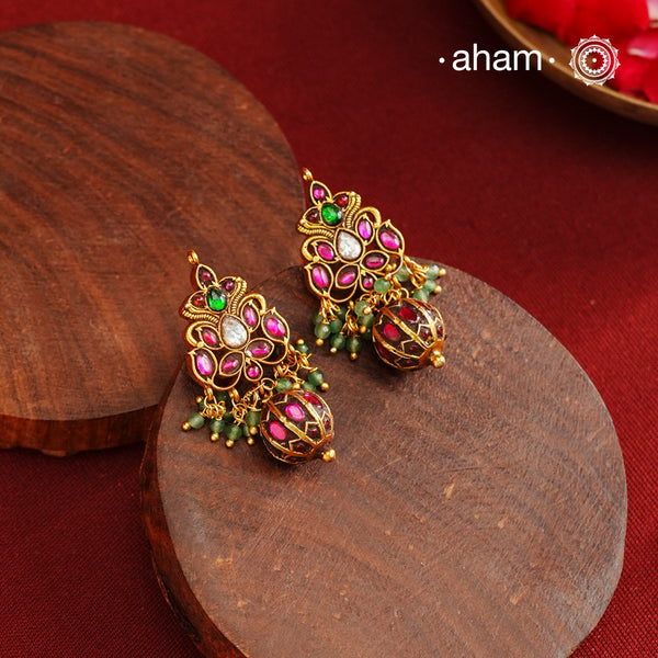 Gold polish silver earrings showcasing intricate kemp work, meticulously handcrafted in 92.5 sterling silver using traditional methods. The rich gold finish enhances their timeless appeal, making them an ideal accessory to elevate ethnic outfits during festive occasions with elegance and authenticity.