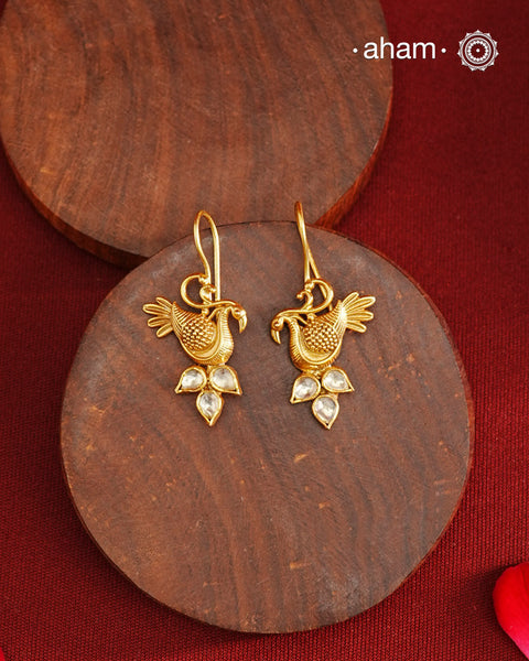 Light weight bird earrings with kundan accents, crafted in 92.5 silver with gold polish. Comes with fishhook for ease of wear.&nbsp;