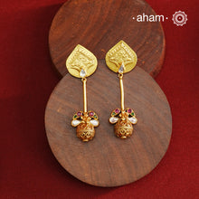 Beautiful drop silver earrings handcrafted using traditional methods in 92.5 sterling silver with gold polish and kundan work. Pair these with your ethnic outfits this festive season to ace your look.