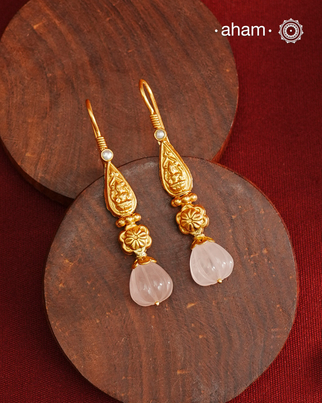 Light weight silver earrings with gold polish with Lakshmiji and a green drop. 
Handcrafted using traditional methods in 92.5 sterling silver with gold polish. 
Pair these with your ethnic outfits this festive season to ace your look.