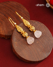 Light weight silver earrings with gold polish with Lakshmiji and a green drop.
Handcrafted using traditional methods in 92.5 sterling silver with gold polish.&nbsp;
Pair these with your ethnic outfits this festive season to ace your look.