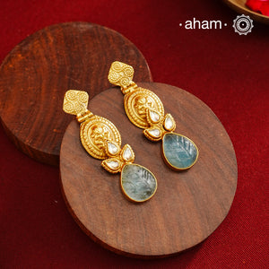 Statement gold polish earring with beautiful stone drop and kundan work.Handcrafted using traditional methods in 92.5 sterling silver with gold polish.Pair these with your ethnic outfits this festive season to ace your look.