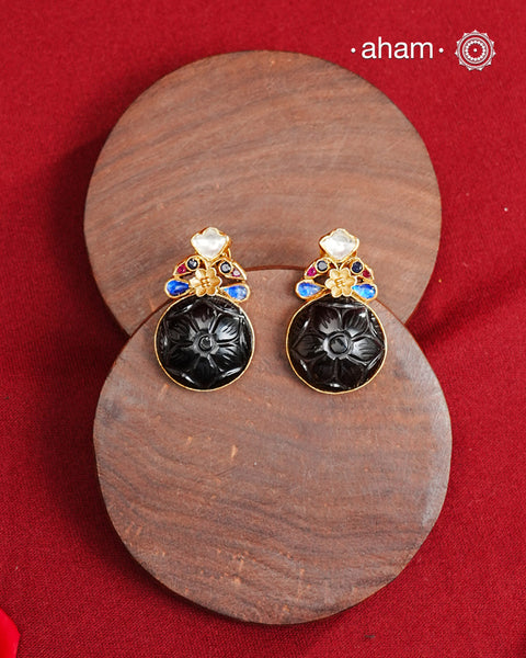 Statement gold polish earring with beautiful carved black onyx and kundan peacocks on the top. 
Handcrafted using traditional methods in 92.5 sterling silver with gold polish. 
Pair these with your ethnic outfits this festive season to ace your look.