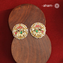 These Nath-inspired silver studs feature intricate kundan and pearl detailing, finished with a rich gold polish. Crafted from 92.5% pure silver, they blend traditional elegance with durability, making them an ideal accessory for festive occasions. Their refined design complements ethnic attire, adding a touch of sophistication to your celebration ensemble.
