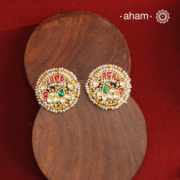 These Nath-inspired silver studs feature intricate kundan and pearl detailing, finished with a rich gold polish. Crafted from 92.5% pure silver, they blend traditional elegance with durability, making them an ideal accessory for festive occasions. Their refined design complements ethnic attire, adding a touch of sophistication to your celebration ensemble.