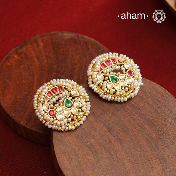 These Nath-inspired silver studs feature intricate kundan and pearl detailing, finished with a rich gold polish. Crafted from 92.5% pure silver, they blend traditional elegance with durability, making them an ideal accessory for festive occasions. Their refined design complements ethnic attire, adding a touch of sophistication to your celebration ensemble.
