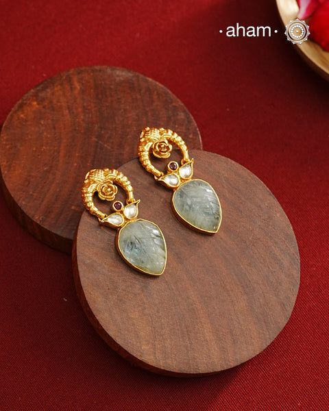 Delicate gold polish earring with beautiful stone drop.
Handcrafted using traditional methods in 92.5 sterling silver with gold polish.&nbsp;
Pair these with your ethnic outfits this festive season to ace your look.