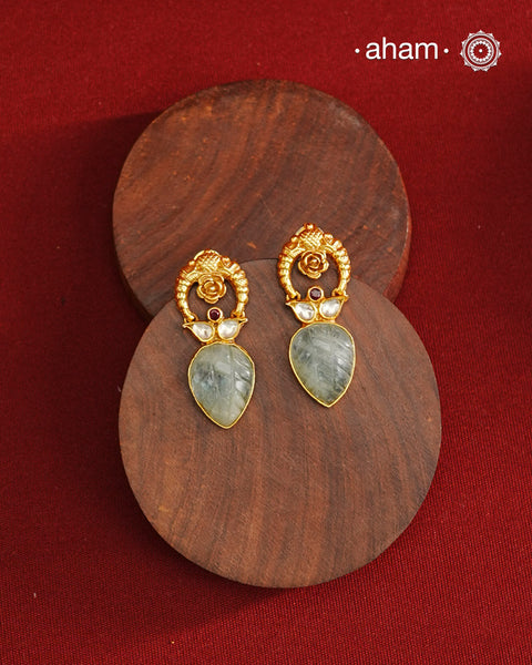 Delicate gold polish earring with beautiful stone drop.
Handcrafted using traditional methods in 92.5 sterling silver with gold polish. 
Pair these with your ethnic outfits this festive season to ace your look.